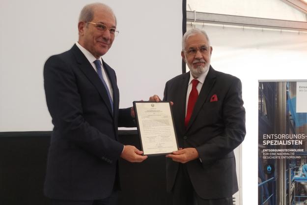 Director-General presents a certificate to the Libyan government in recognition of the complete destruction of all its declared chemical weapon stockpiles.